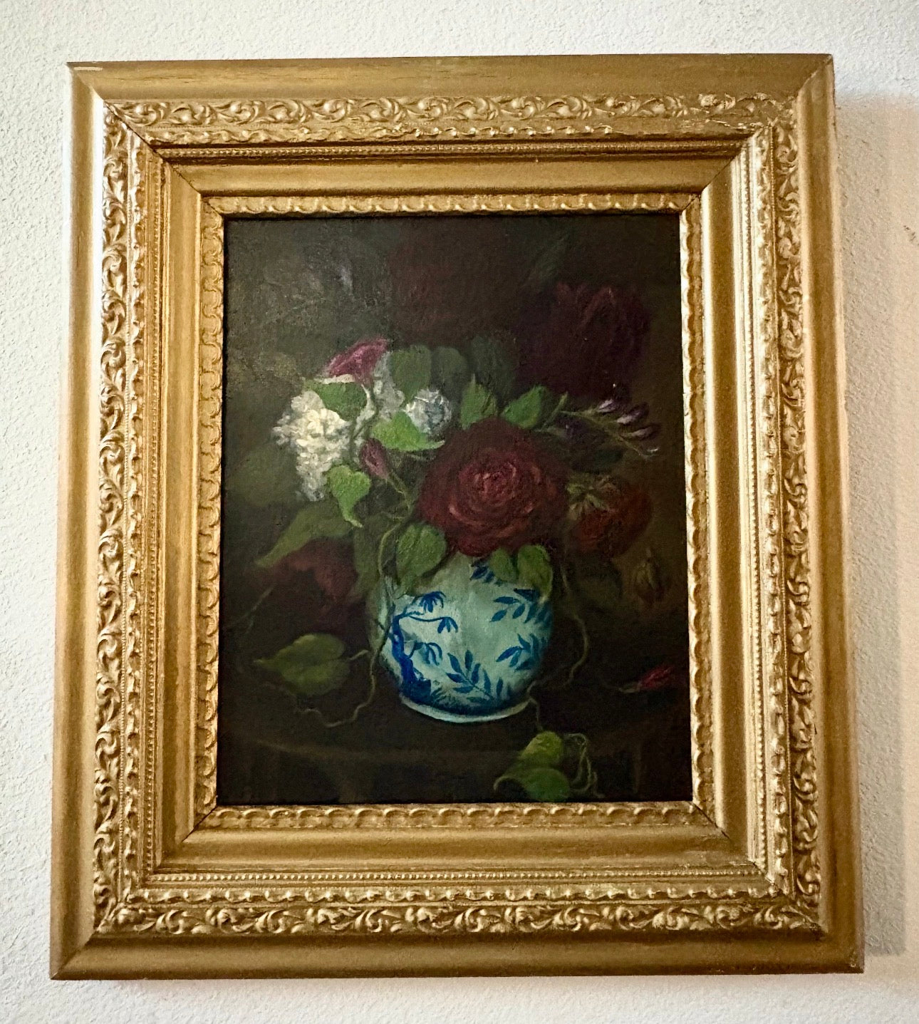 Original floral still life painting of roses in blue and white vase emerging from shadow in soft chiaroscuro light