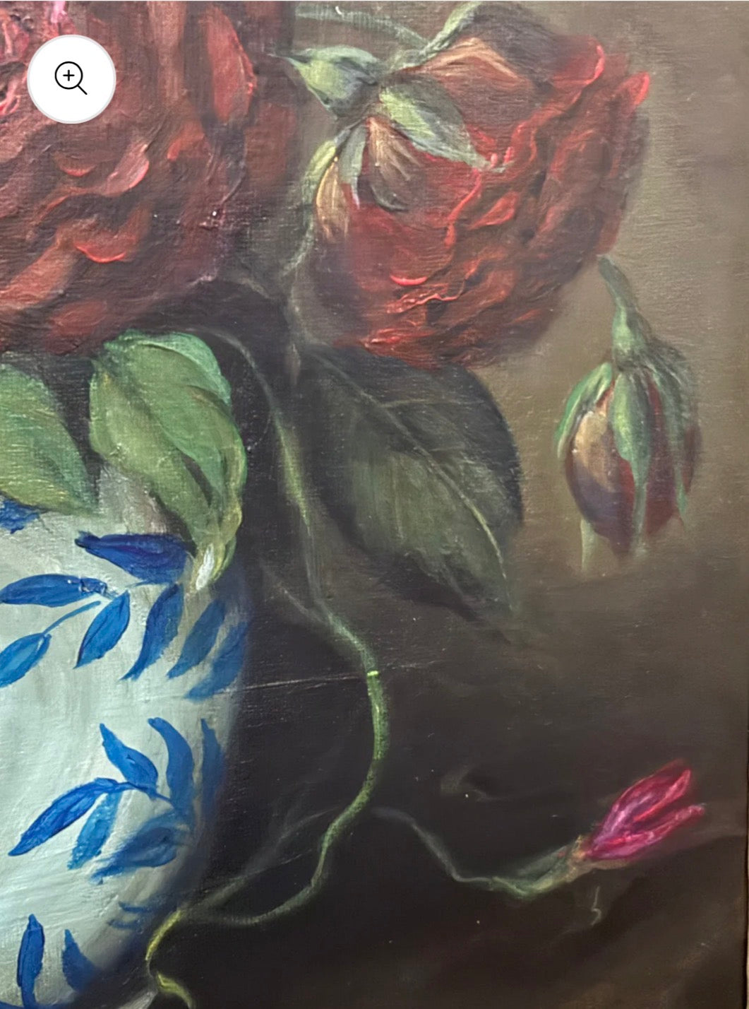 Close-up of a painting of red roses and green leaves on a textured surface.