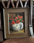 Original still life painting of red flowers in blue and white teacup with soft light