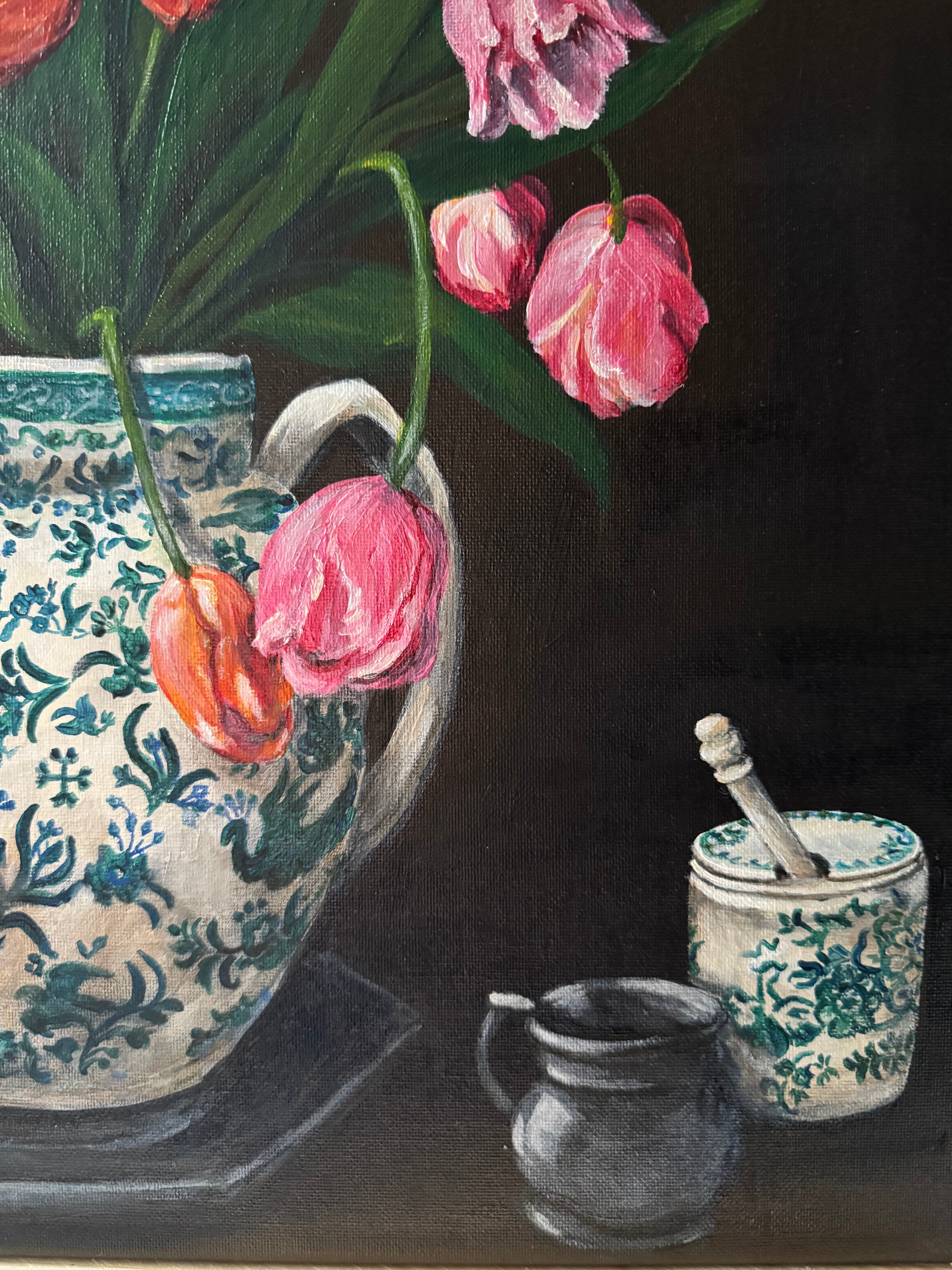 Still life with pink tulips, a honey jar and pewter jug on a dark background