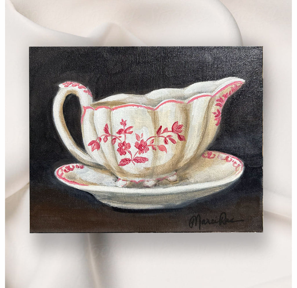 Painting of a decorative gravy boat with pink floral patterns on a dark background.