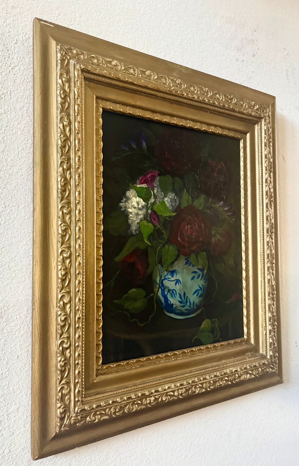 Original floral still life painting of roses in blue and white vase emerging from shadow in soft chiaroscuro light